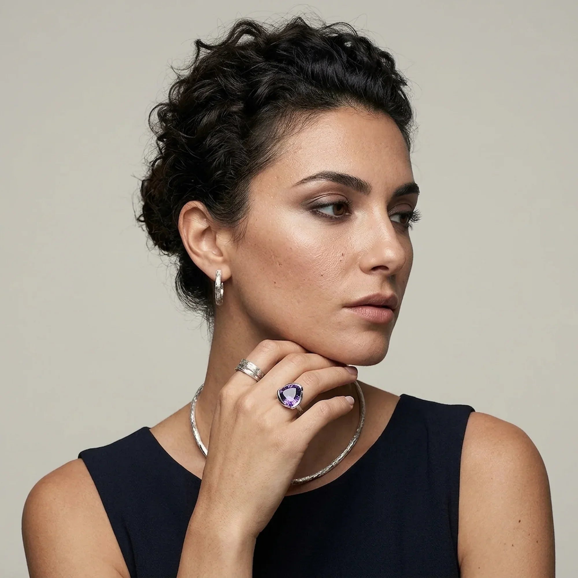 Woman wearing a 925 silver amethyst lotus cocktail ring by Luna Dura — the lotus flower, a symbol of purity and renewal, handcrafted in Dubai.