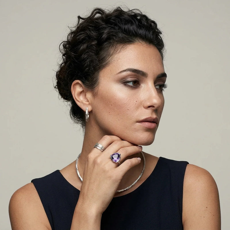 Woman wearing a 925 silver amethyst lotus cocktail ring by Luna Dura — the lotus flower, a symbol of purity and renewal, handcrafted in Dubai.