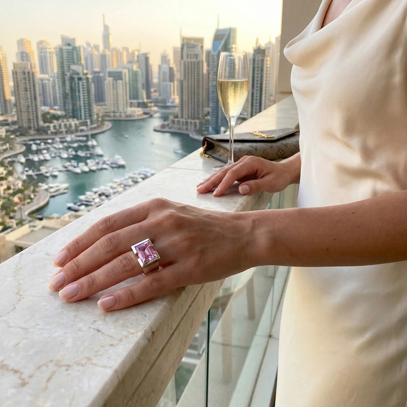 Woman wearing a pink sapphire ring in 925 sterling silver, the September birthstone, styled in Dubai.