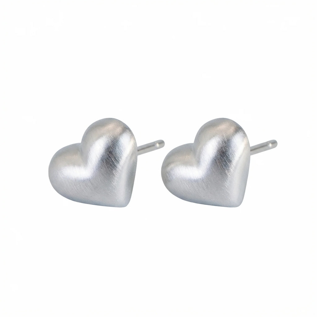 Heart silver stud earrings in 925 sterling on white background Dubai | Position note: Main product layout