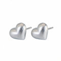 Heart silver stud earrings in 925 sterling on white background Dubai | Position note: Main product layout
