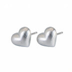 Heart silver stud earrings in 925 sterling on white background Dubai | Position note: Main product layout