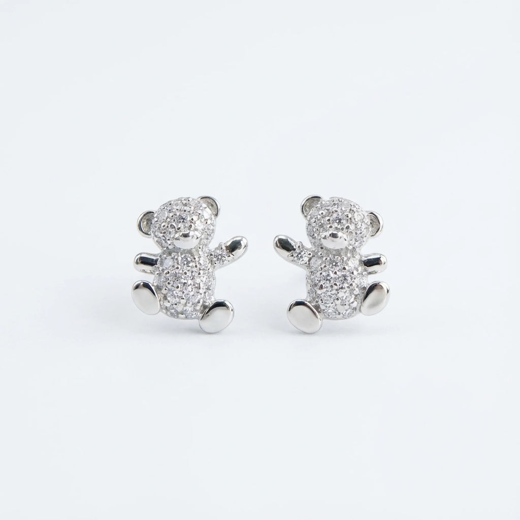 925 silver teddy bear stud earrings isolated on a white background in a Dubai studio.