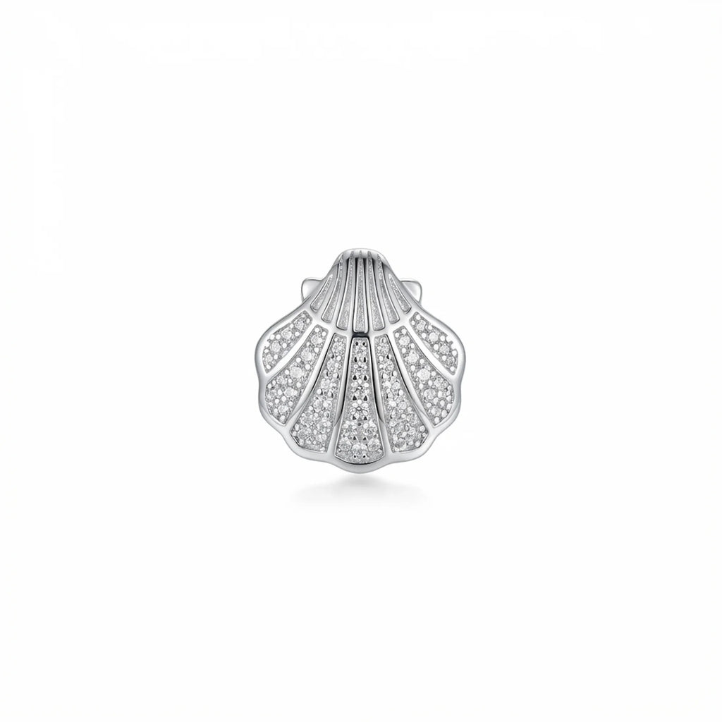 Close-up of a single silver shell ear stud featuring handset cubic zirconia detailing.