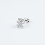 Macro close-up of a rhodium-plated silver teddy bear ear stud in Dubai.