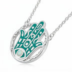 Silver necklace with a green Hamsa hand pendant on a white background