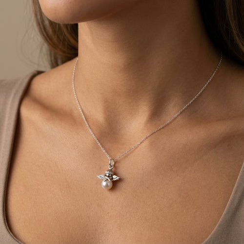 Necklace with a pendant featuring a pearl on a models neck, size display in dubai