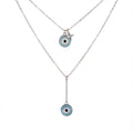 Necklace 925 silver with two blue evil eye pendants in Dubai on a white background.