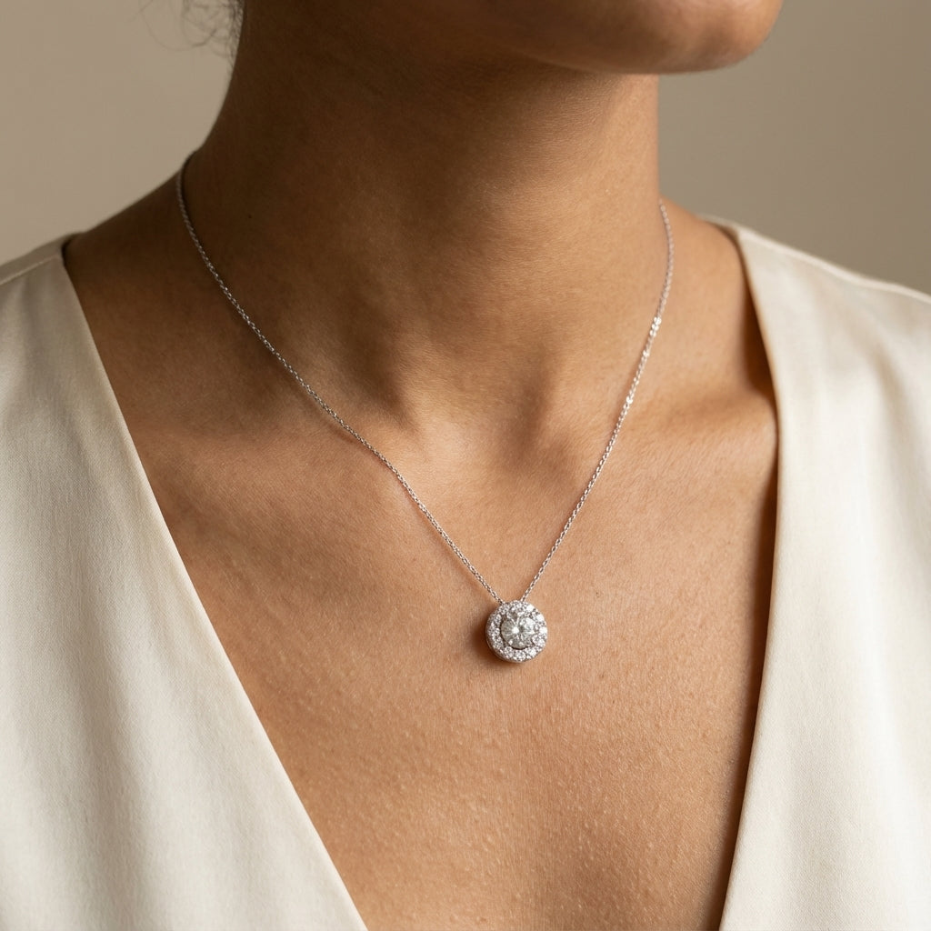 Sterling silver Necklace with a Cz pendant worn by a model in a cream-colored top.