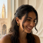Woman wearing ribbed 18K gold vermeil crescent moon hoop earrings indoors in DIFC Dubai.
