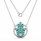 teal enamel hamsa hand pendant in 925 silver with central opal stone and engraved circular frame