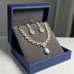 18k gold-plated cubic zirconia halo teardrop necklace and earring set displayed in a luxury navy gift box in Dubai.
