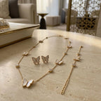 Extender chain and lobster clasp closure detail on 18K gold plated mother of pearl butterfly necklace and bracelet.