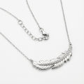 sterling Silver plume necklace on a white background