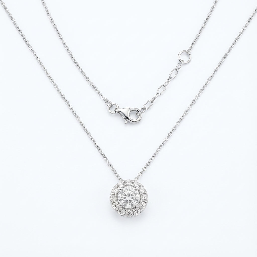 Silver necklace with a round pendant on a white background