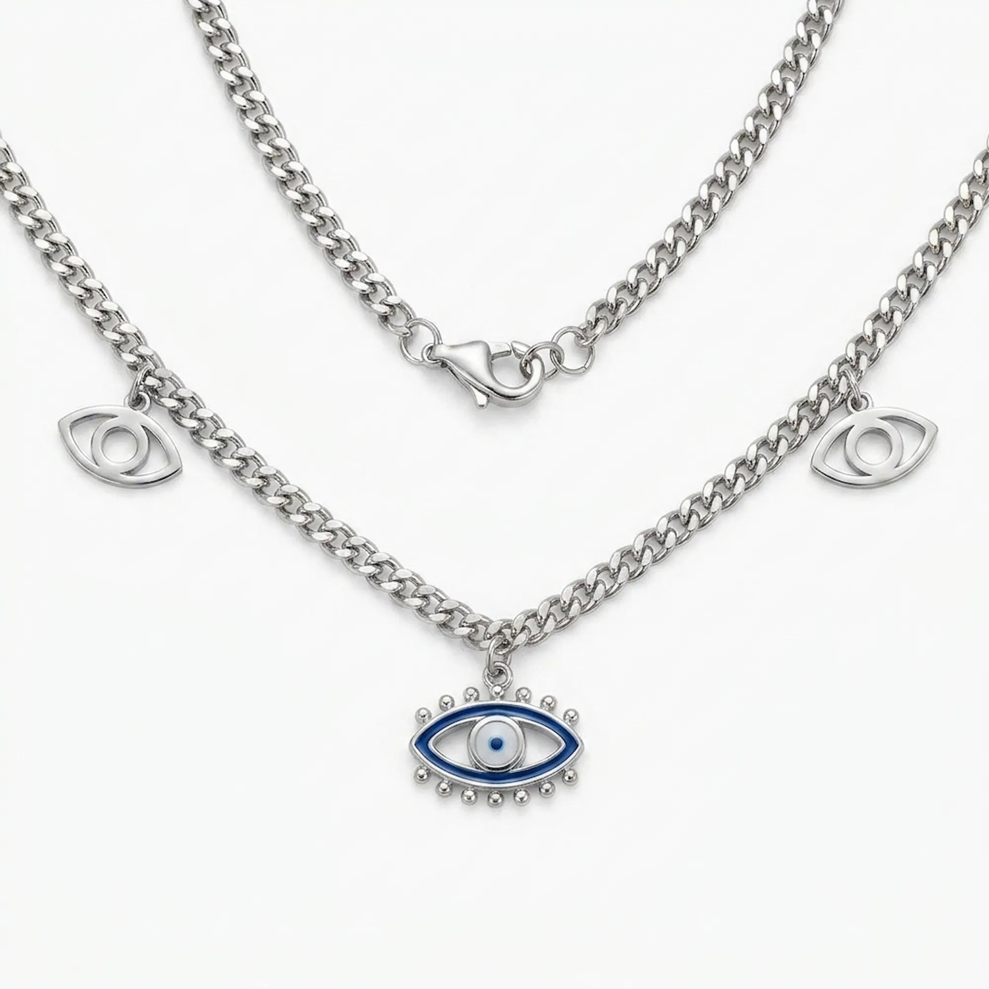 silver evil eye charm necklace with blue enamel center pendant and two side eye charms on a curb chain