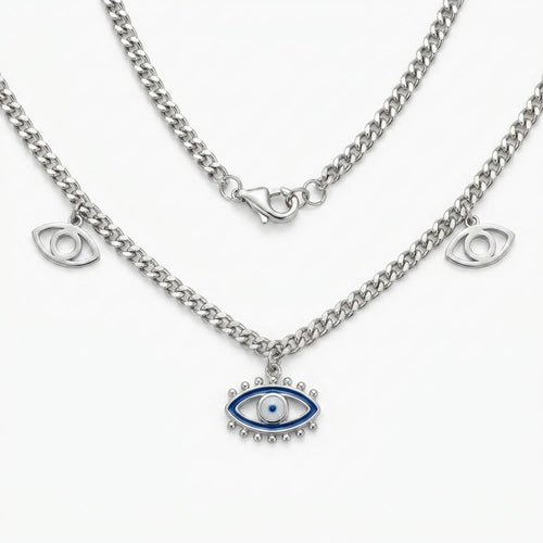 silver evil eye charm necklace with blue enamel center pendant and two side eye charms on a curb chain