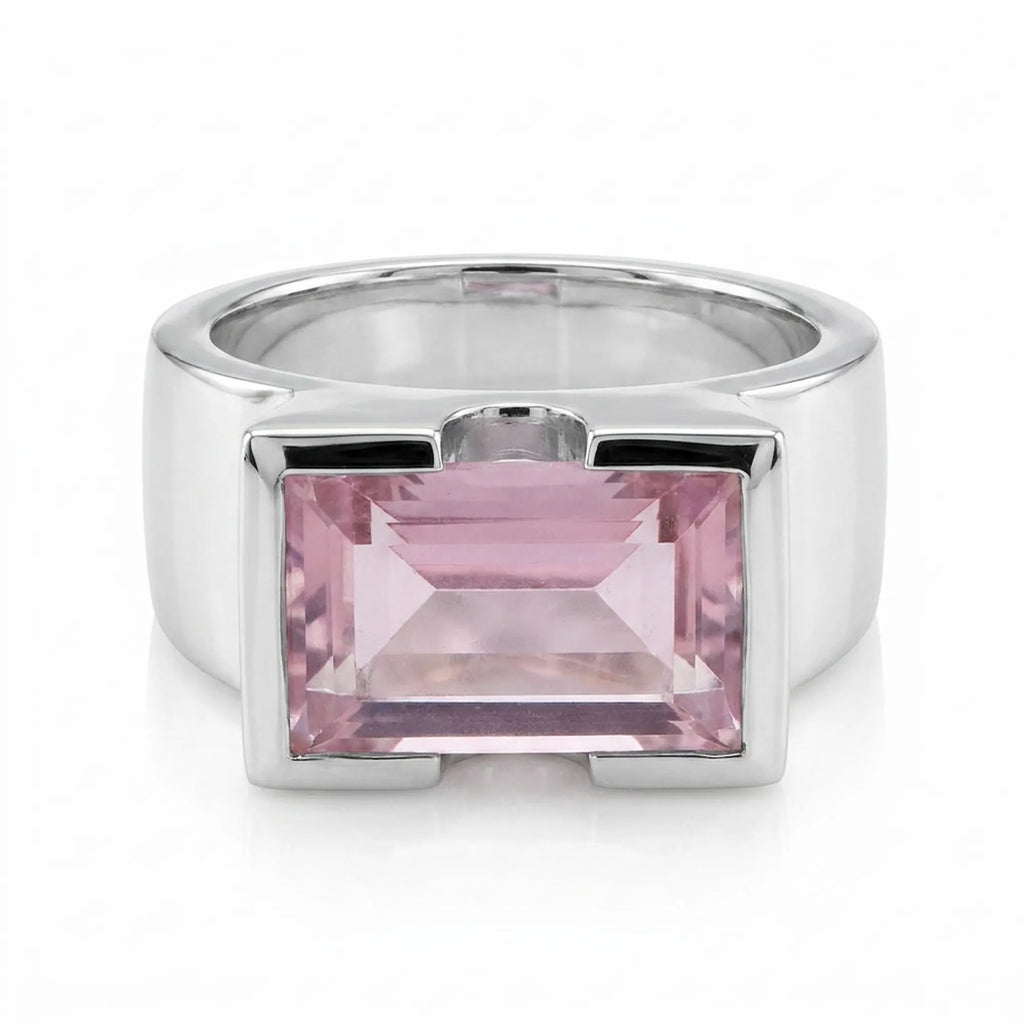 Silver ring with a pink gemstone on a white background