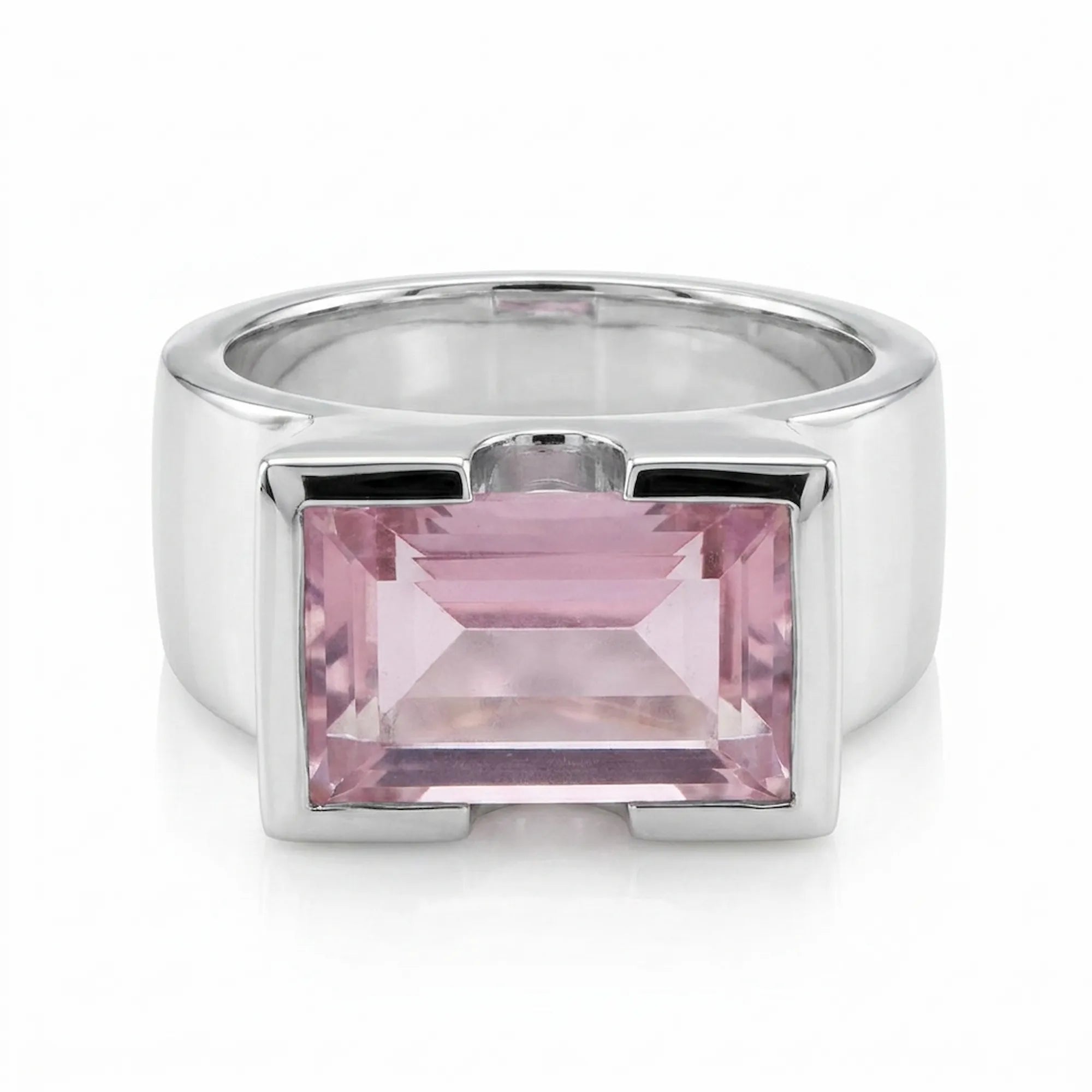 Silver ring with a pink gemstone on a white background