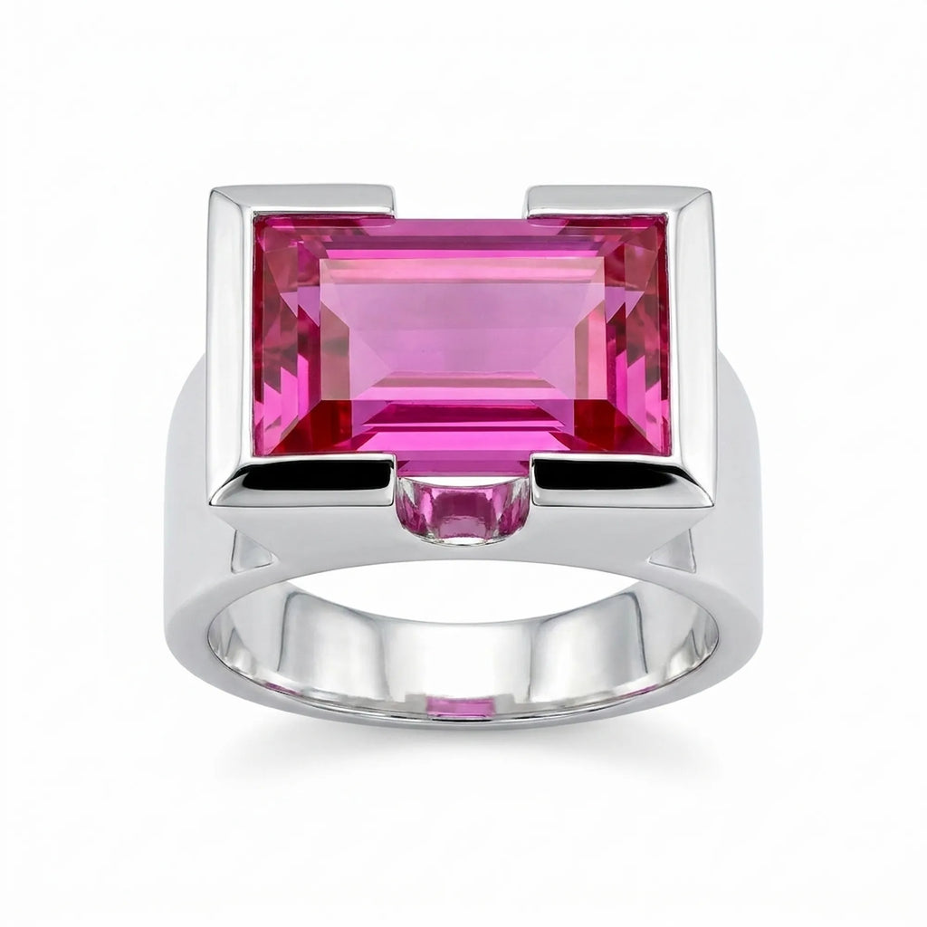 Silver ring with a magenta quartz gemstone on a white background
