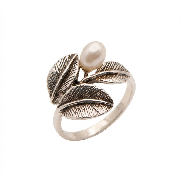oxidized silver ring with detailed leaf design and freshwater pearl accent Luna Dura Dubai.