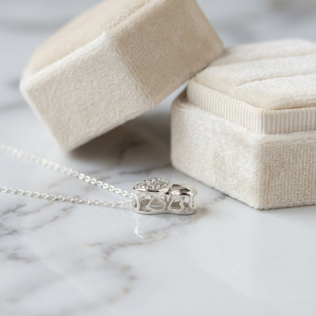 macro photo display the Silver necklace with a double heart-shaped  perforated in the top side of the heart pendant