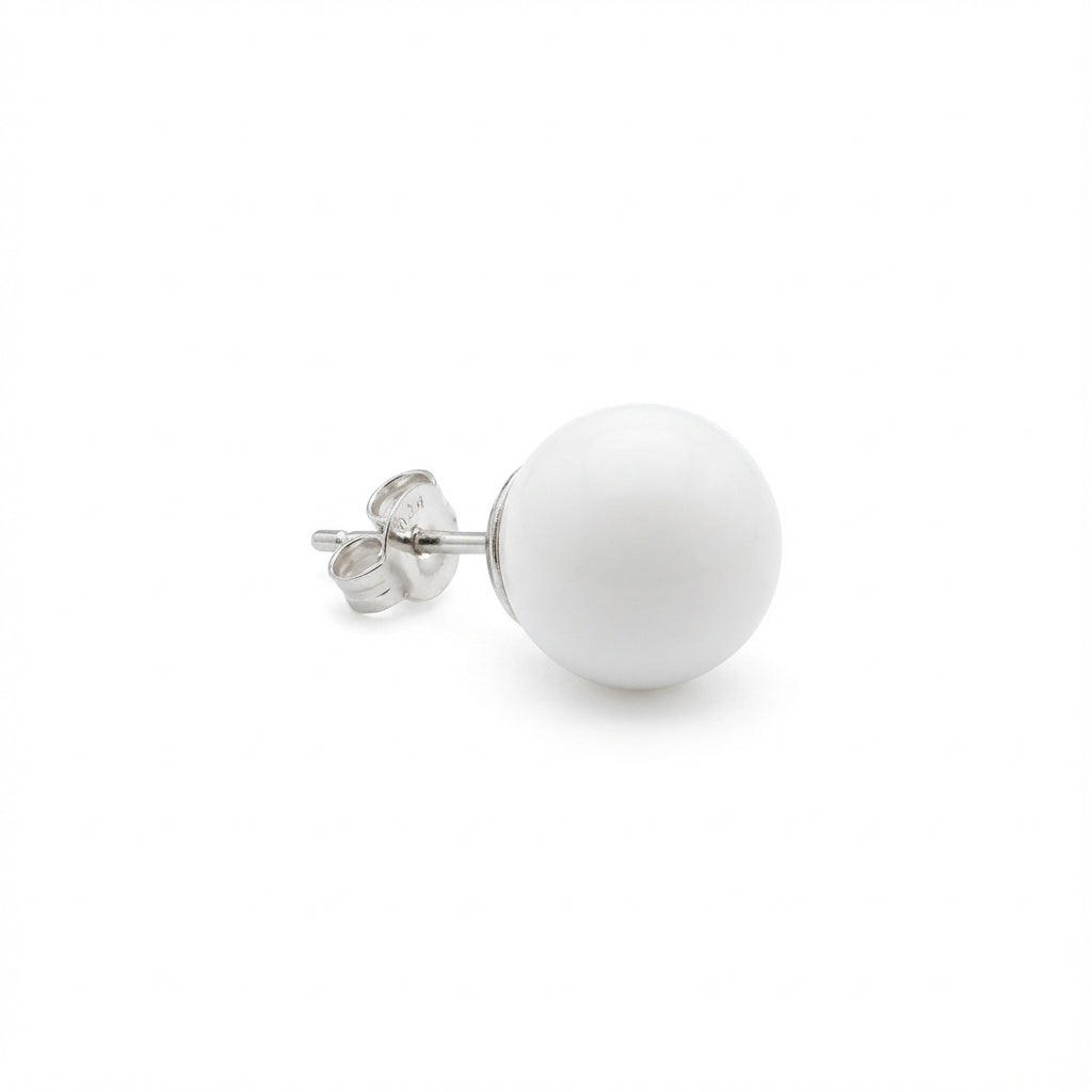 White spherical stud earring on a white background