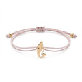 rose gold mermaid bracelet on greige satin paracord in Dubai with silver beads and tag, feminine and beach-inspired.