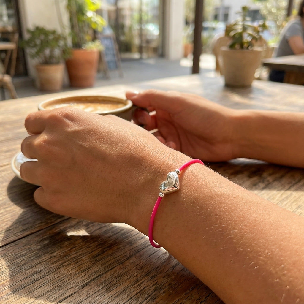 Silver Heart Bracelet on Vivid Pink Rubber Cord