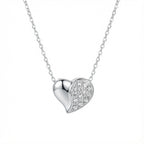 Dual Heart sterling silver Necklace heart-shaped necklace with pave stones on one side over white background