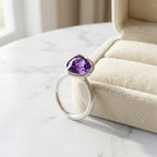 925 silver amethyst lotus cocktail ring with an 8.5 carat natural amethyst resting on a box, a gift in Dubai.