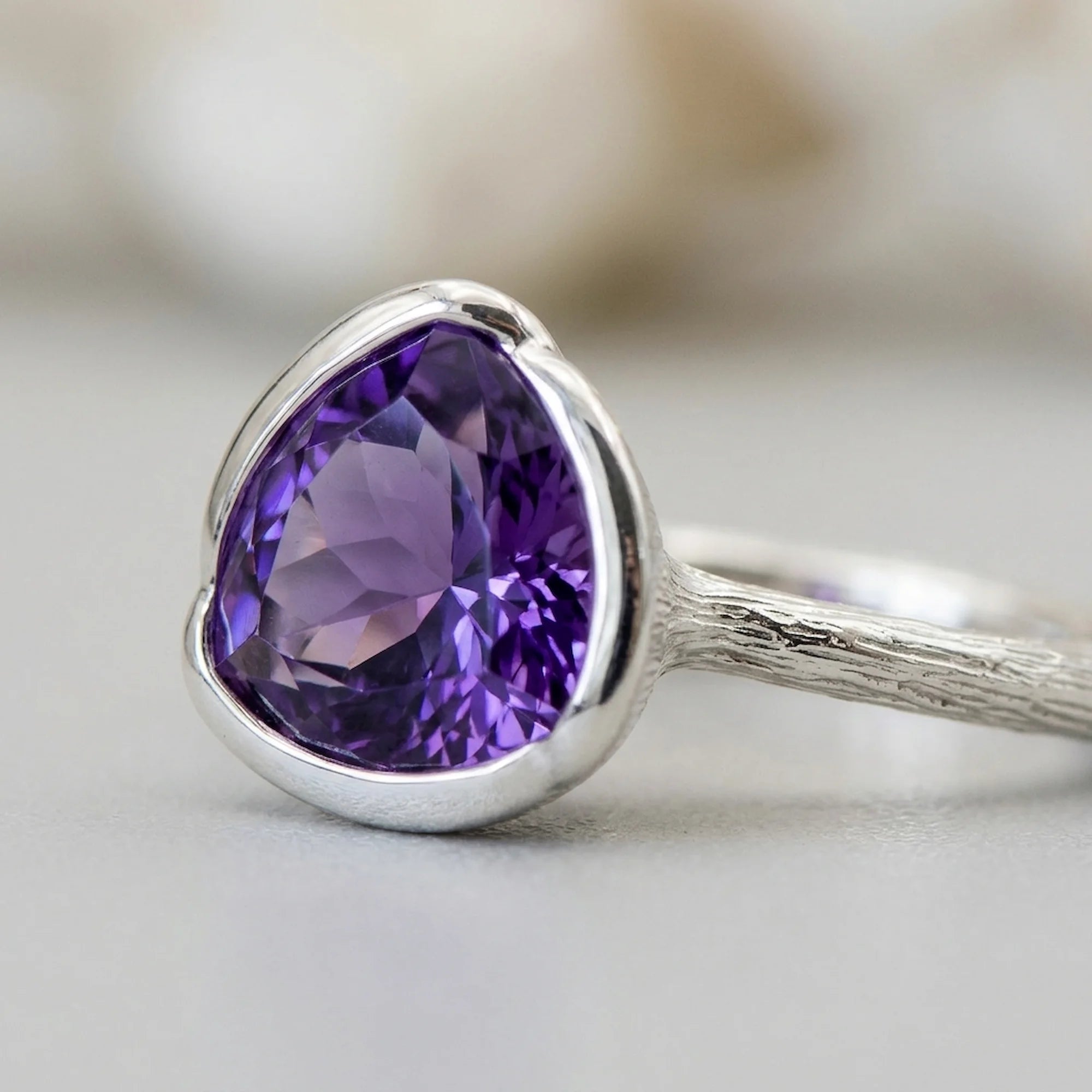 silver amethyst lotus cocktail ring featuring a natural amethyst in a silver semi-bezel, a birthday gift in Dubai.
