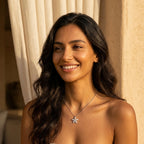 Woman wearing a 925 silver daisy pendant necklace outdoors in Dubai, a sparkling birthday gift.