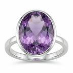 Angled view of a 925 silver oval amethyst ring showing the thick, protective bezel setting and smooth band