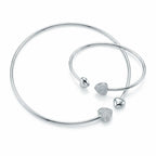 Front view of the luxury 925 silver solid collar necklace and matching bangle set featuring a cubic zirconia pave heart pendant on a white background.