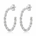 925 silver twisted rope hoop earrings styled on ear — sterling silver everyday jewelry in Dubai.