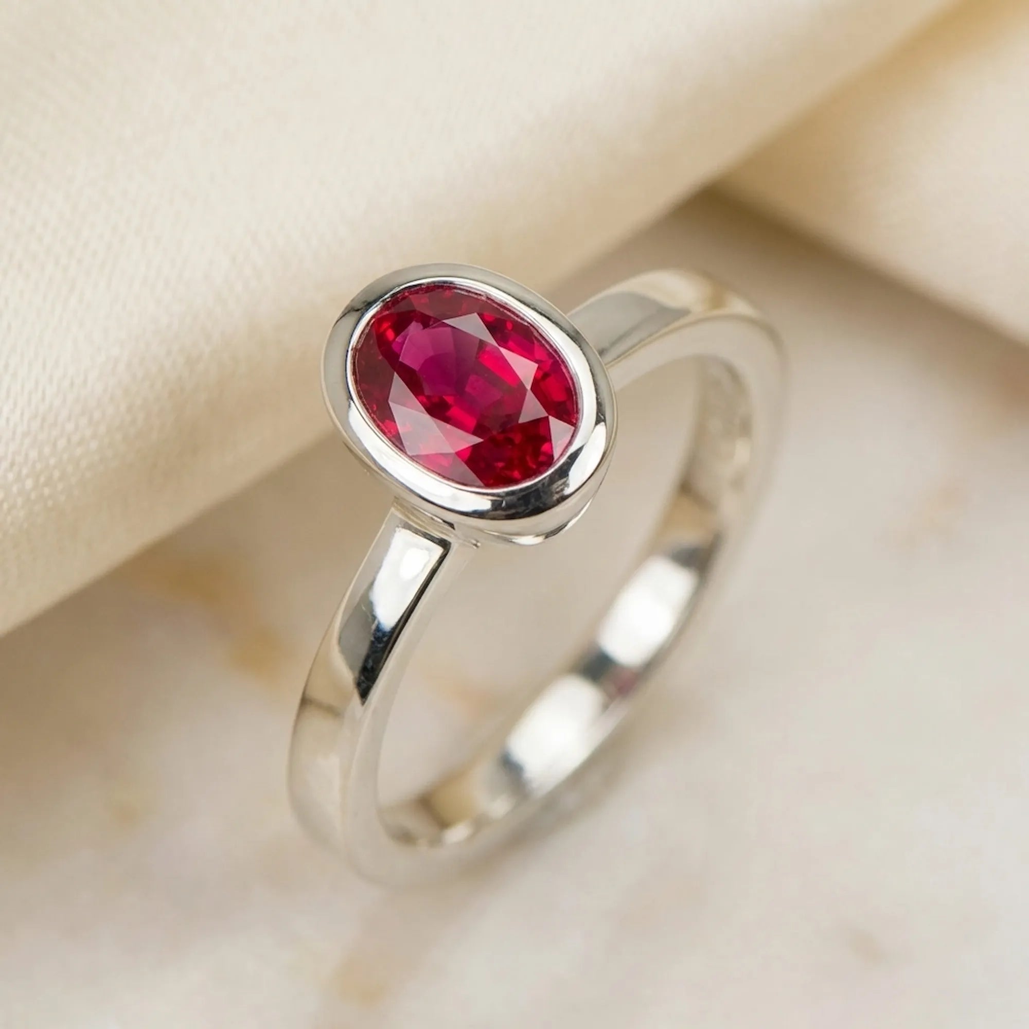 macro detail of 925 sterling silver ring showing bright polish finish and smooth bezel craftsmanship