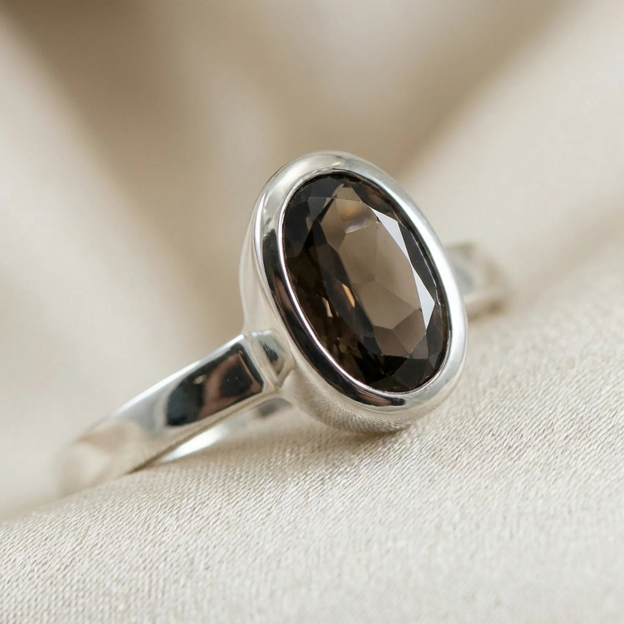 macro detail of 925 sterling silver ring showing bright polish finish and bezel craftsmanship around smoky quartz