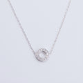 Geometric Silver necklace design with a circular pendant in Dubai on a light gray background.