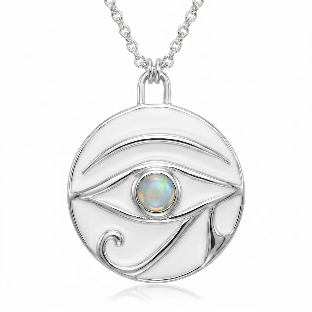 Round silver pendant with white enamel Eye of Horus design and central white opal stone