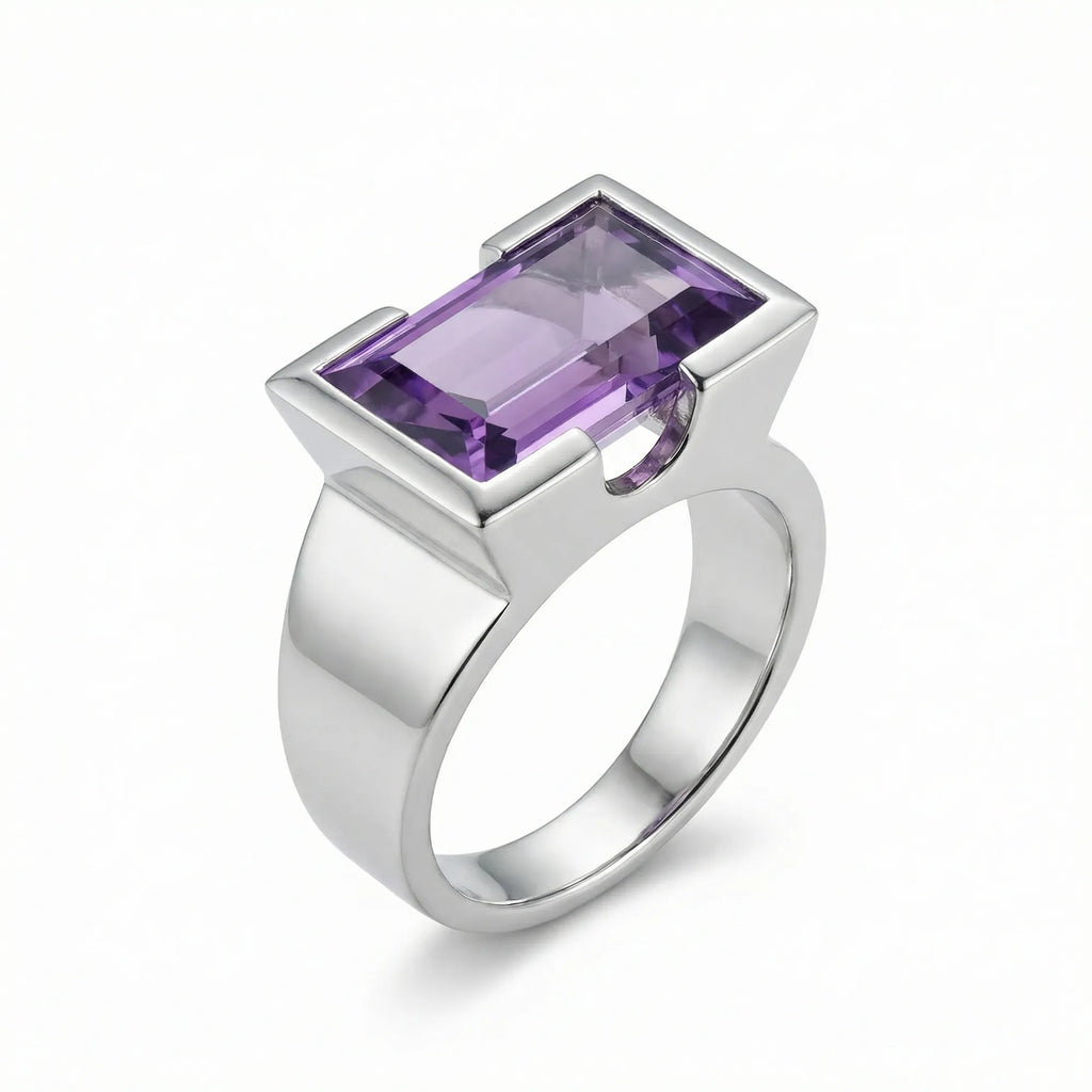 Natural amethyst cocktail ring in 925 sterling silver with open-profile half-bezel setting, 3/4 view on white background