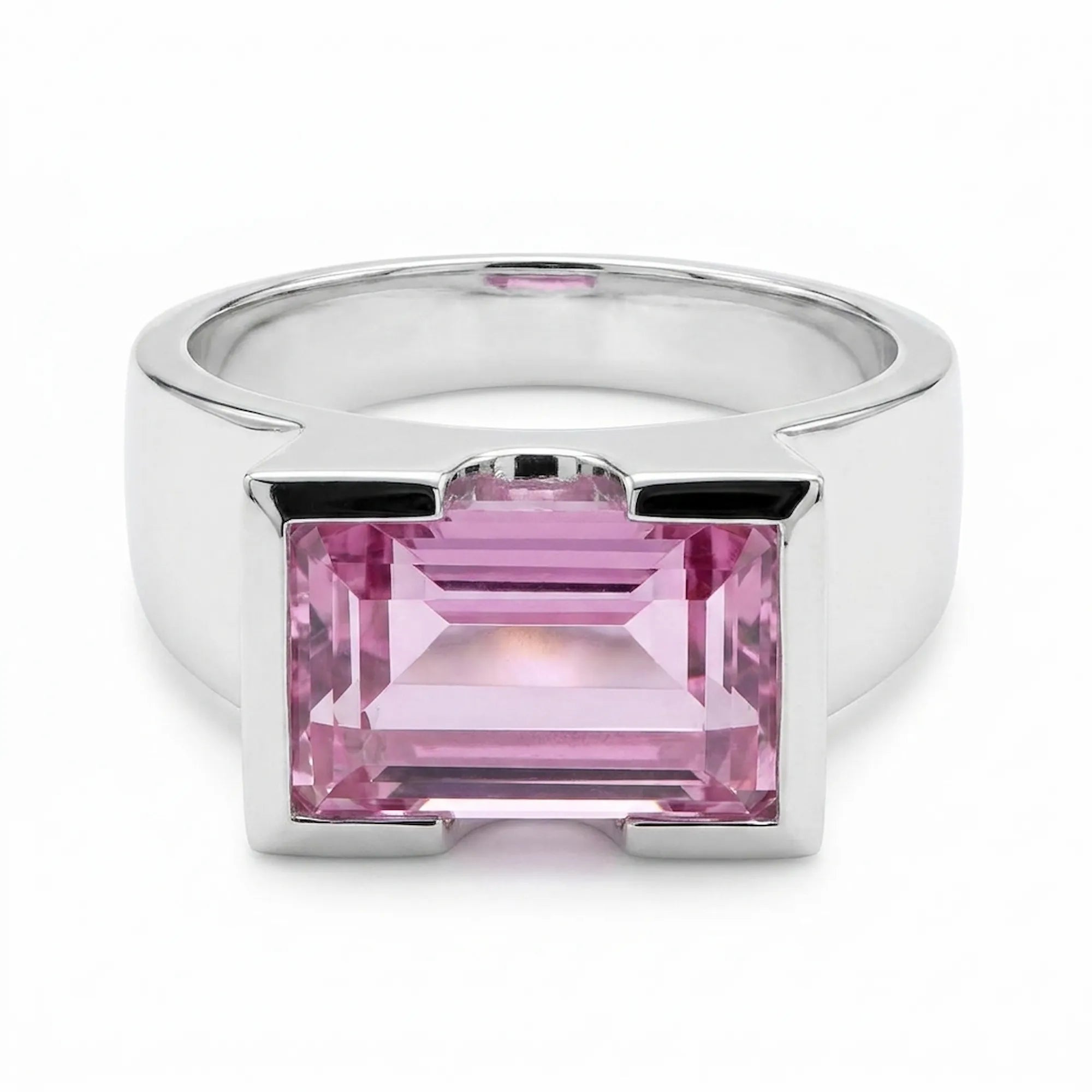 Silver ring with a pink gemstone on a white background second angle 