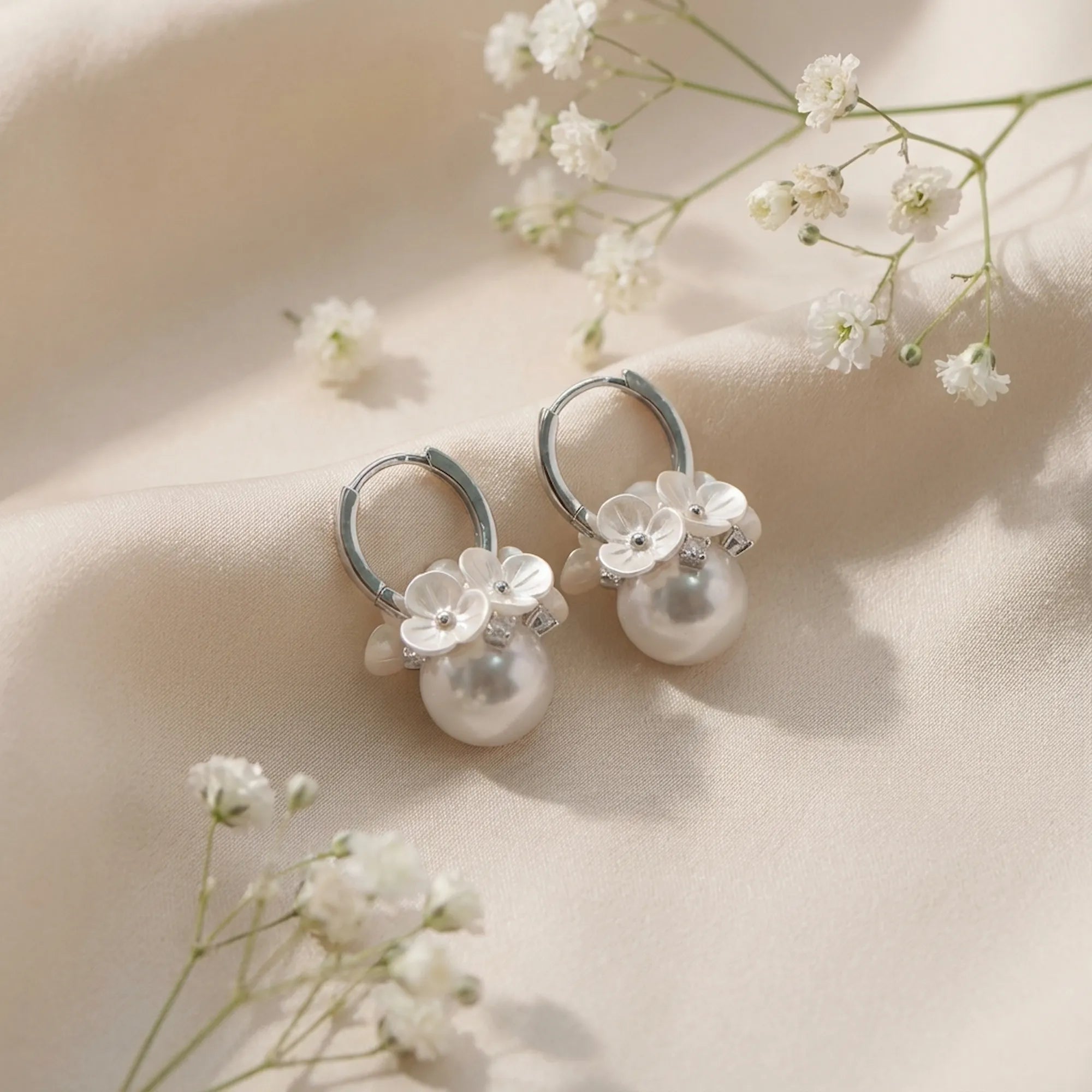 View the exquisite floral details of these artificial pearl earrings online, crafted from 925 silver and cubic zirconia.
