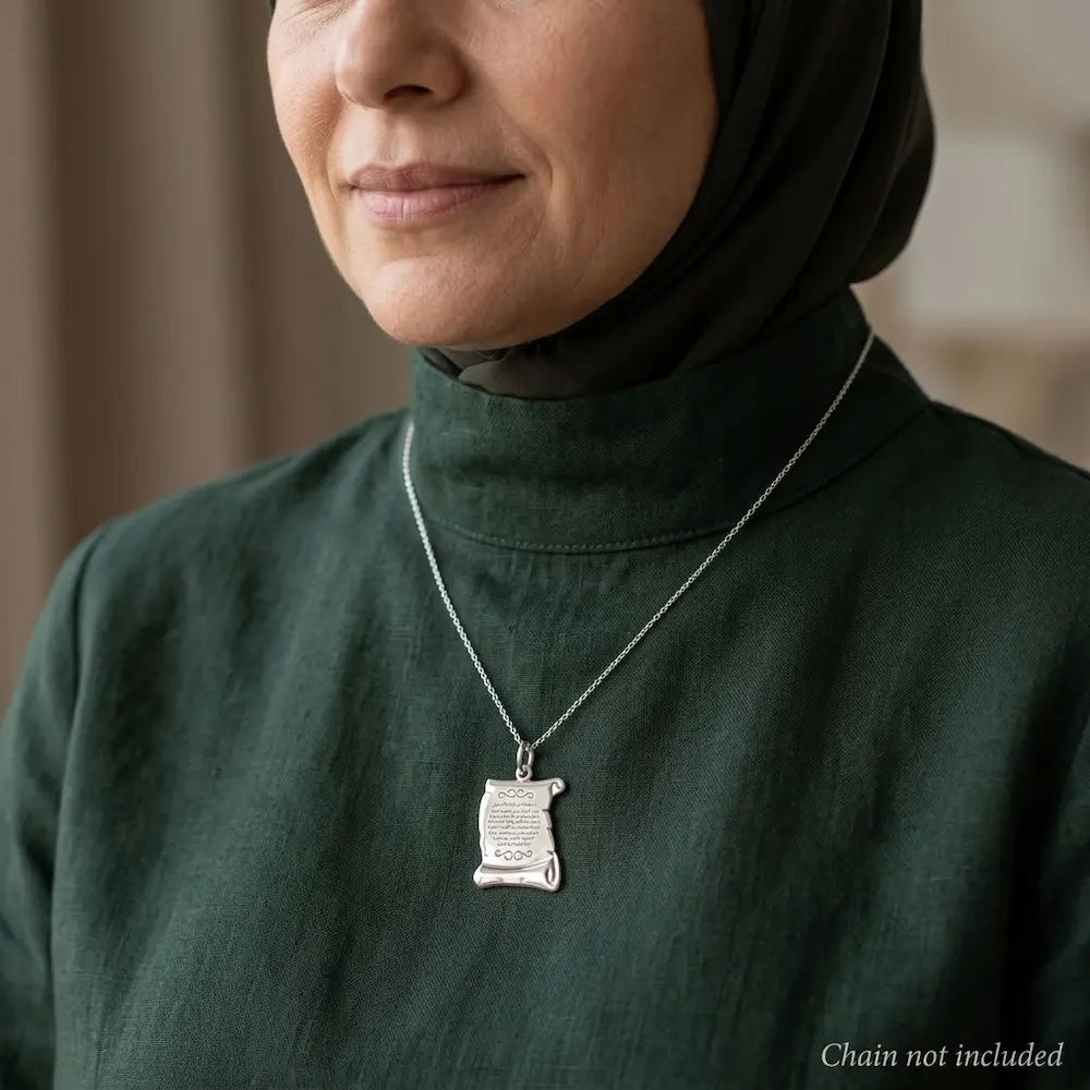 Woman wearing a 925 sterling silver Ayat Al-Kursi scroll pendant on a styling chain that is not included