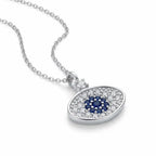 Oval concave blue evil eye pendant with clear and blue CZ on a fine 50 cm sterling silver rolo chain.
