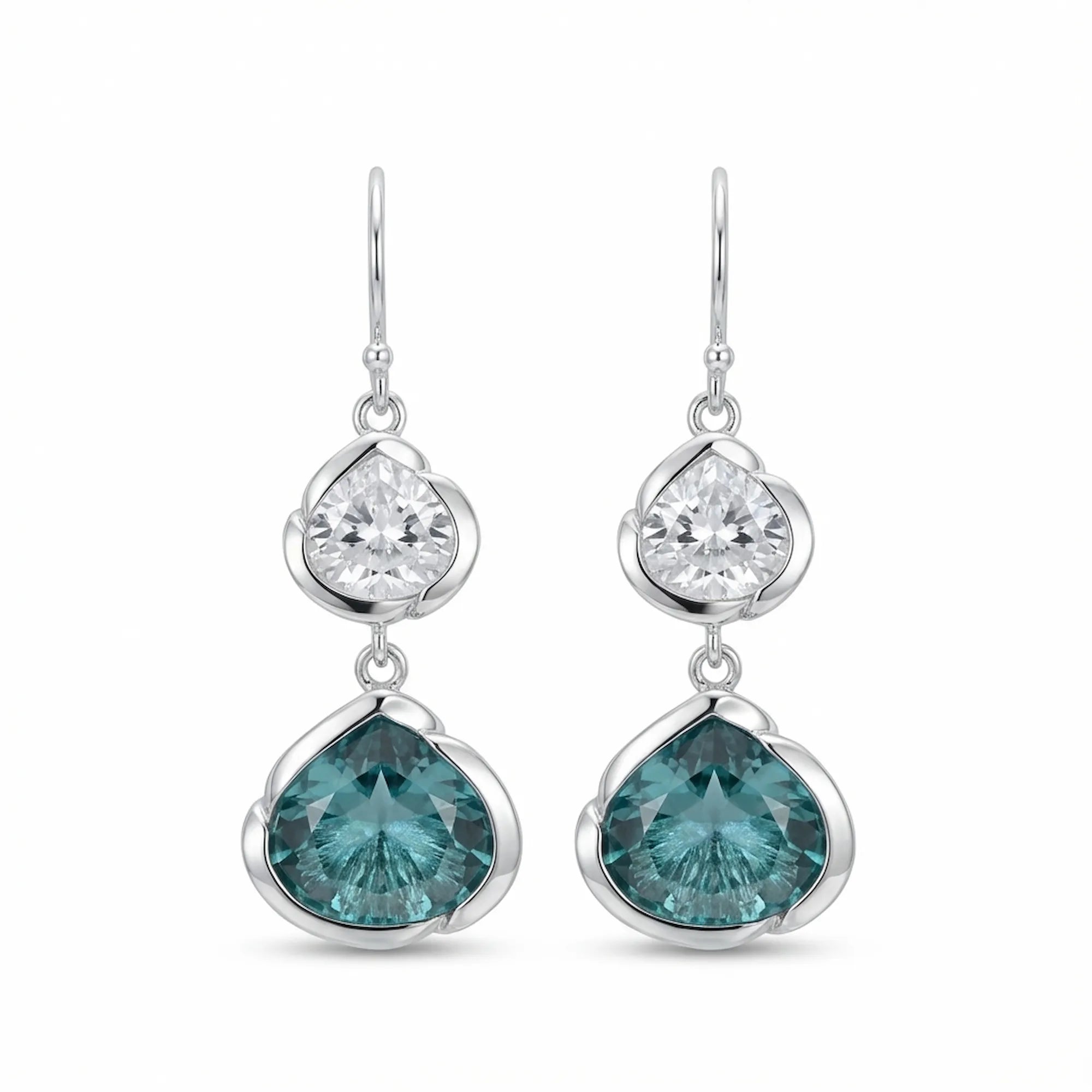 925 silver lotus dangle earrings with white topaz above sky blue topaz, on white. Luna Dura.