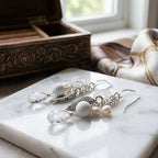 Close-up detail of the premium 925 sterling silver leaf motif, simulated pearl, and snow quartz on our bohemian chain drop earrings.