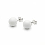 Pair of white sphere stud earrings in 925 sterling silver with polished posts and butterfly backs, on a white background.