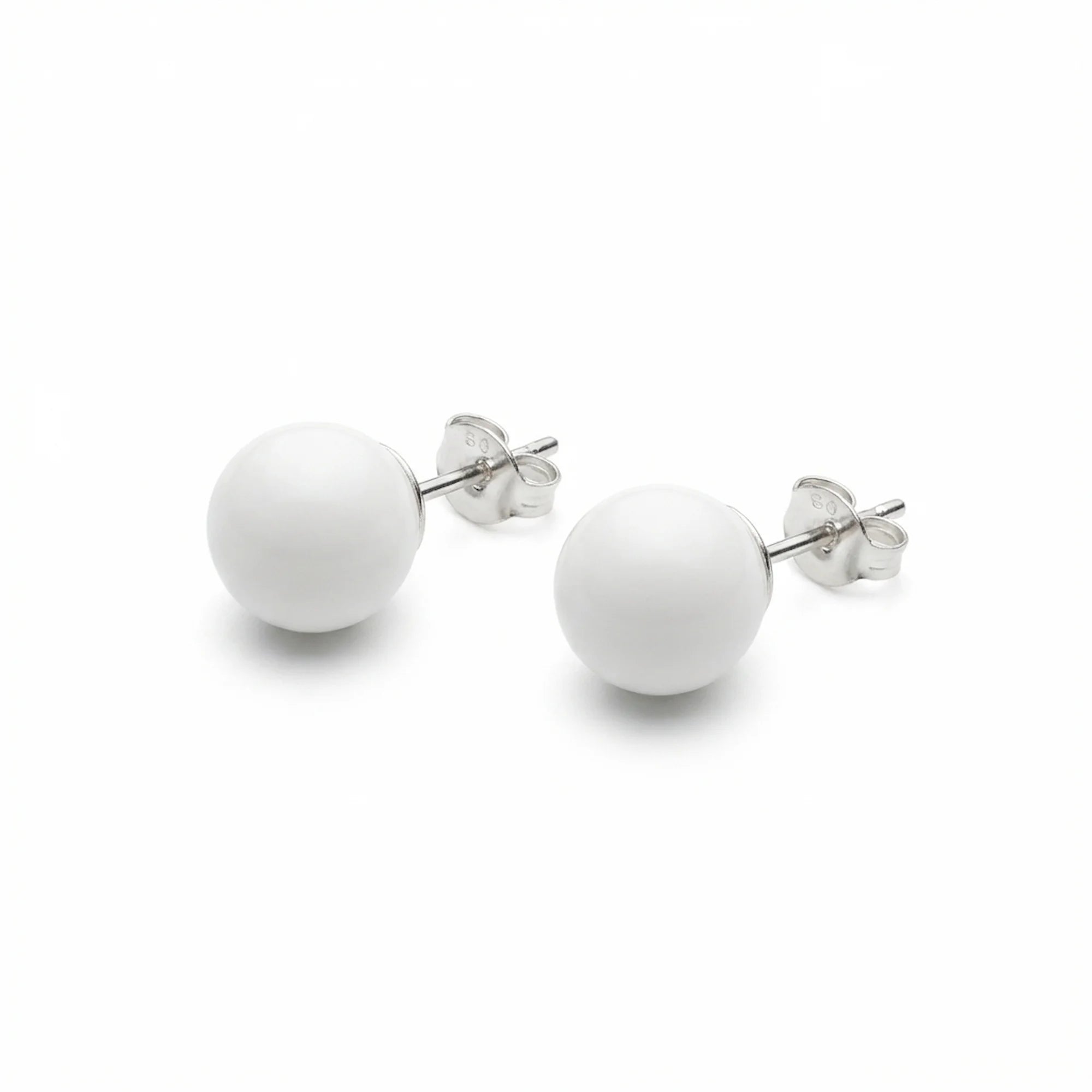 Pair of white sphere stud earrings in 925 sterling silver with polished posts and butterfly backs, on a white background.