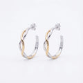 Two-tone silver and gold bypass hoop earrings on white background — interlaced wave design, post-back, 925 sterling silver.